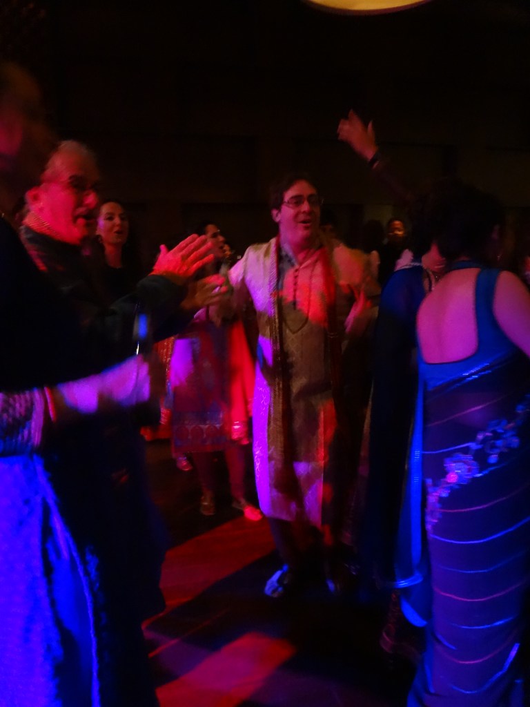 Fabiana's father and brother dancing.