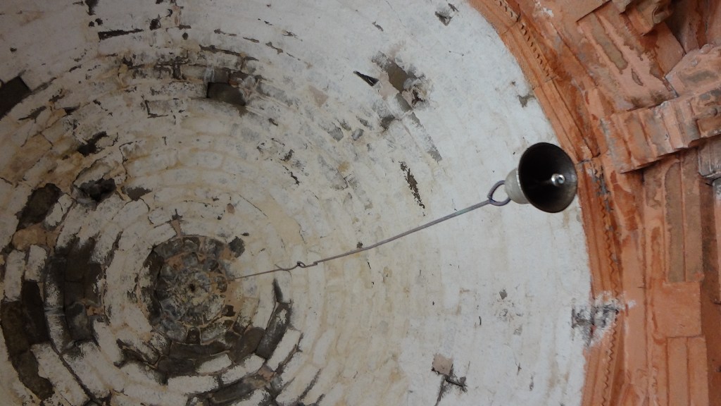 Temple dome with swinging bell